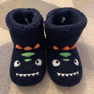 Blue dinosaur slippers